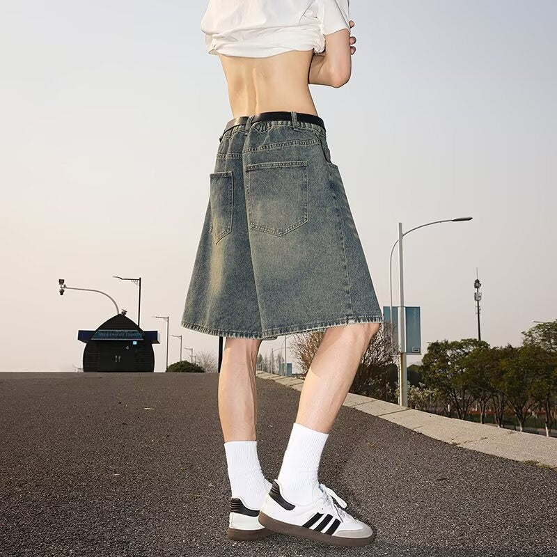 Washed and worn semi elastic waist denim shorts