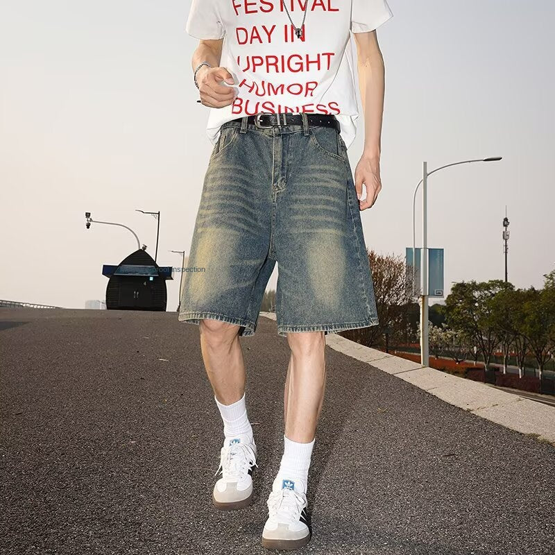 Washed and worn semi elastic waist denim shorts