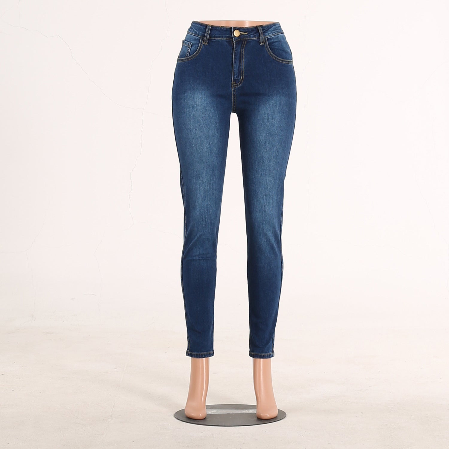 Spring slim fit solid color lifting buttocks elastic slimming fashion knee hole women's jeans European and American