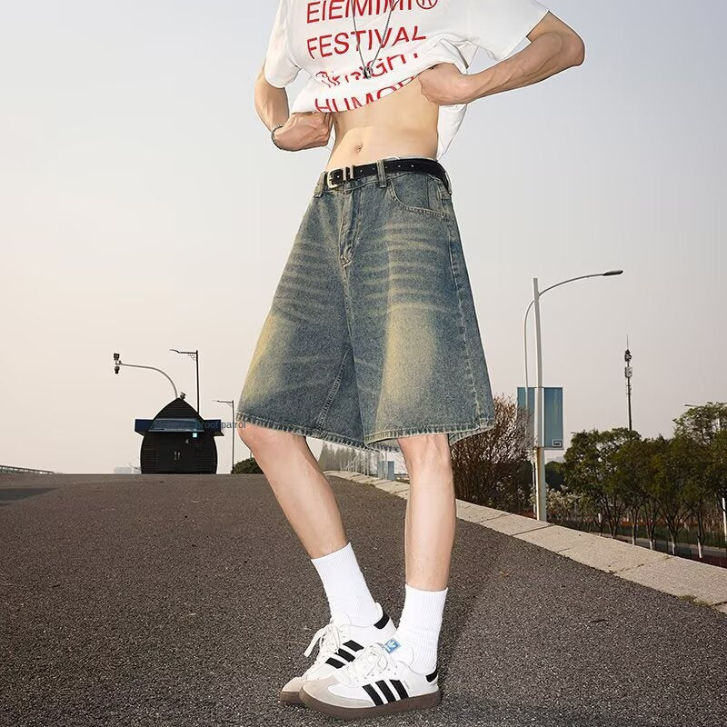 Washed and worn semi elastic waist denim shorts