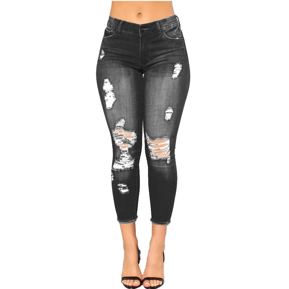 Summer high elasticity 9-point perforated women's clothing, tight fitting and hip lifting fashionable jeans with small feet